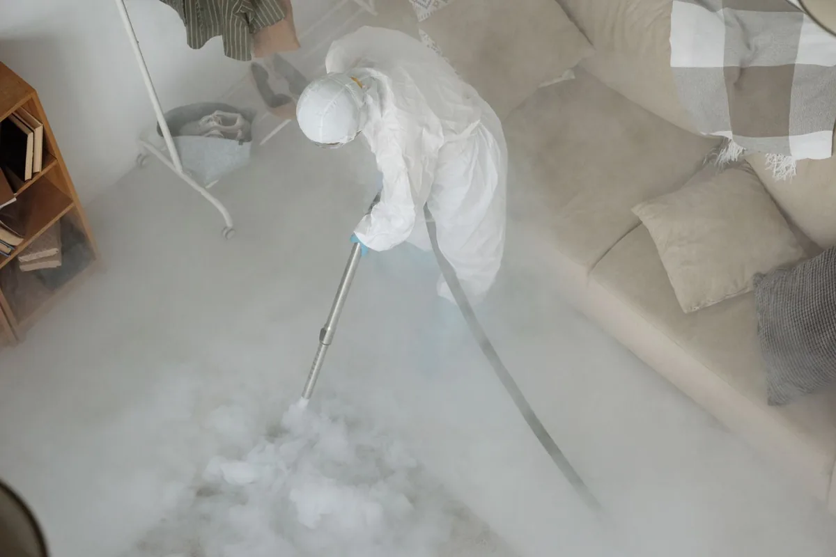 Biohazard cleanup technician in protective equipment, Bandon, OR